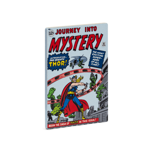 This 1oz pure silver COMIX™ Coin displays a coloured image of the cover of the 1962 comic book, Journey into Mystery #83. To mimic a comic book, it is crafted into a rectangular shape and coloured on all four sides to represent the spine and pages - New Zealand Mint. 