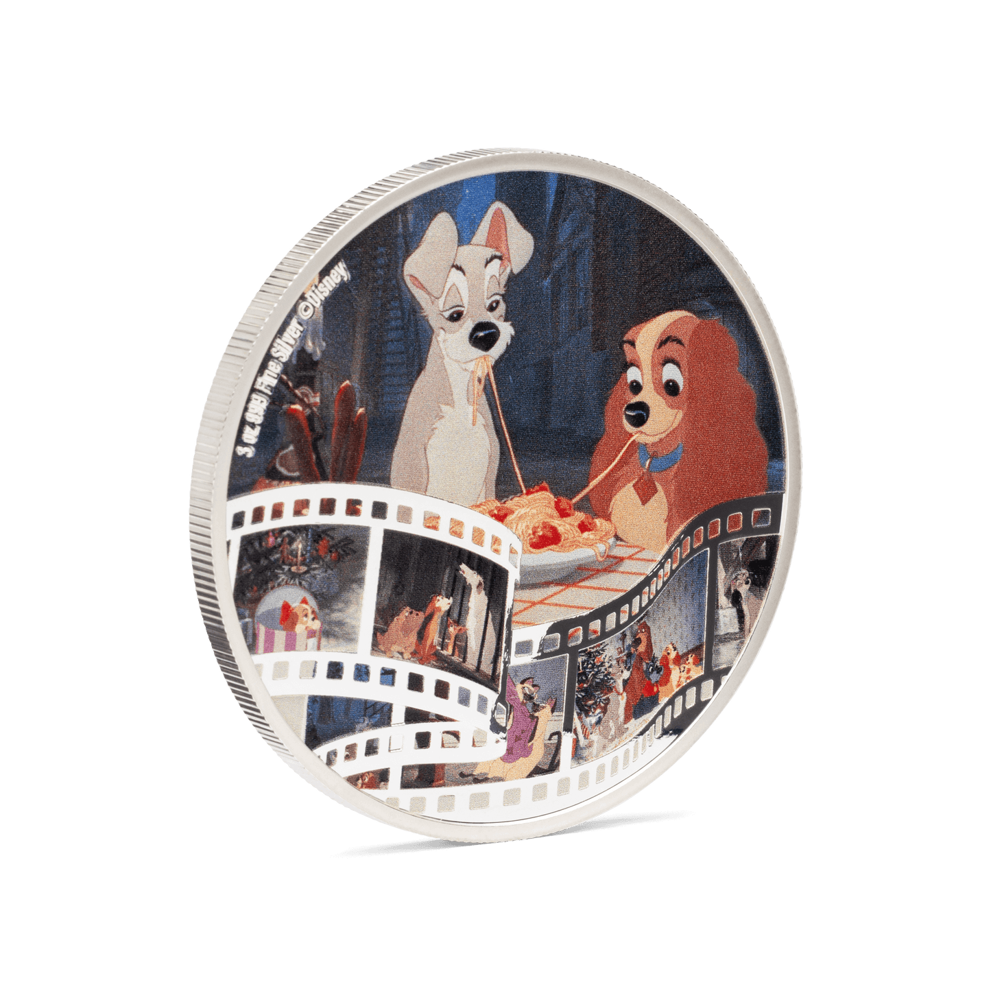 The coin shows a beloved scene, in full colour, where the two dogs are on a romantic evening and share a plate of spaghetti. Along the bottom is a film scroll, showcasing a lovely montage of all your favourite characters from the movie. - New Zealand Mint