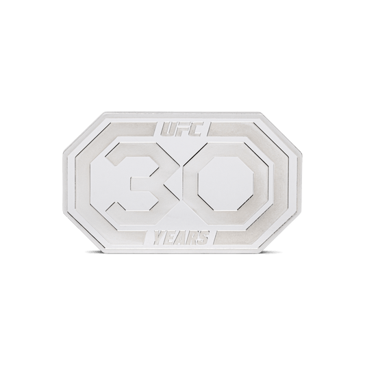 Champion 30 years of legendary moments with this incredible 1oz pure silver coin! Shaped like an octagon to display the UFC Event Canvas. The 30th-anniversary logo is highlighted in a stunning rainbow effect to further mark the special milestone. - New Zealand Mint